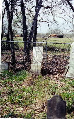 W. C., W. C., and John Wallace tombstones