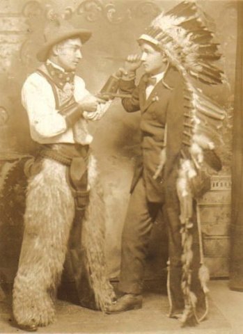 Lyle Bullock, the 'cowboy', holds a friend, dressed as an 'Indian', at gunpoint.

Photo courtesy of Kim Fowles.
