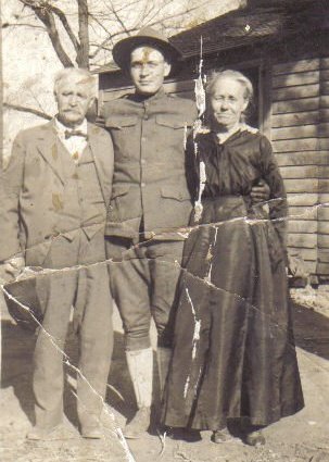 Lyle Bullock in WWI army uniform with his grandparents, Rev. C.W. Owens & Molie Owens.