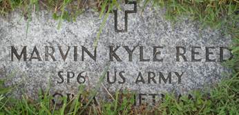 A grave stone in the grass
AI-generated content may be incorrect.