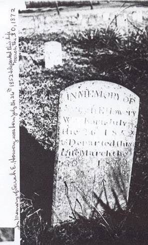 A picture containing text, tree, gravestone, stone

Description automatically generated