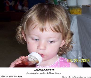 A baby drinking from a bottle

Description automatically generated with low confidence
