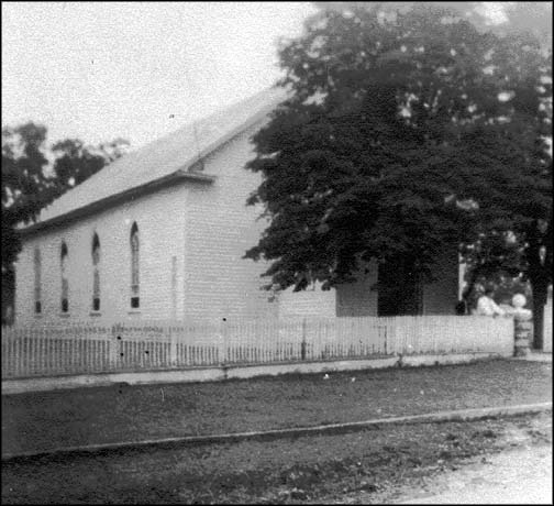 Walnut Springs Frame church with its new portico over the front door.